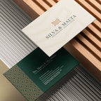 Two business cards with Silva & Malta branding on a textured surface