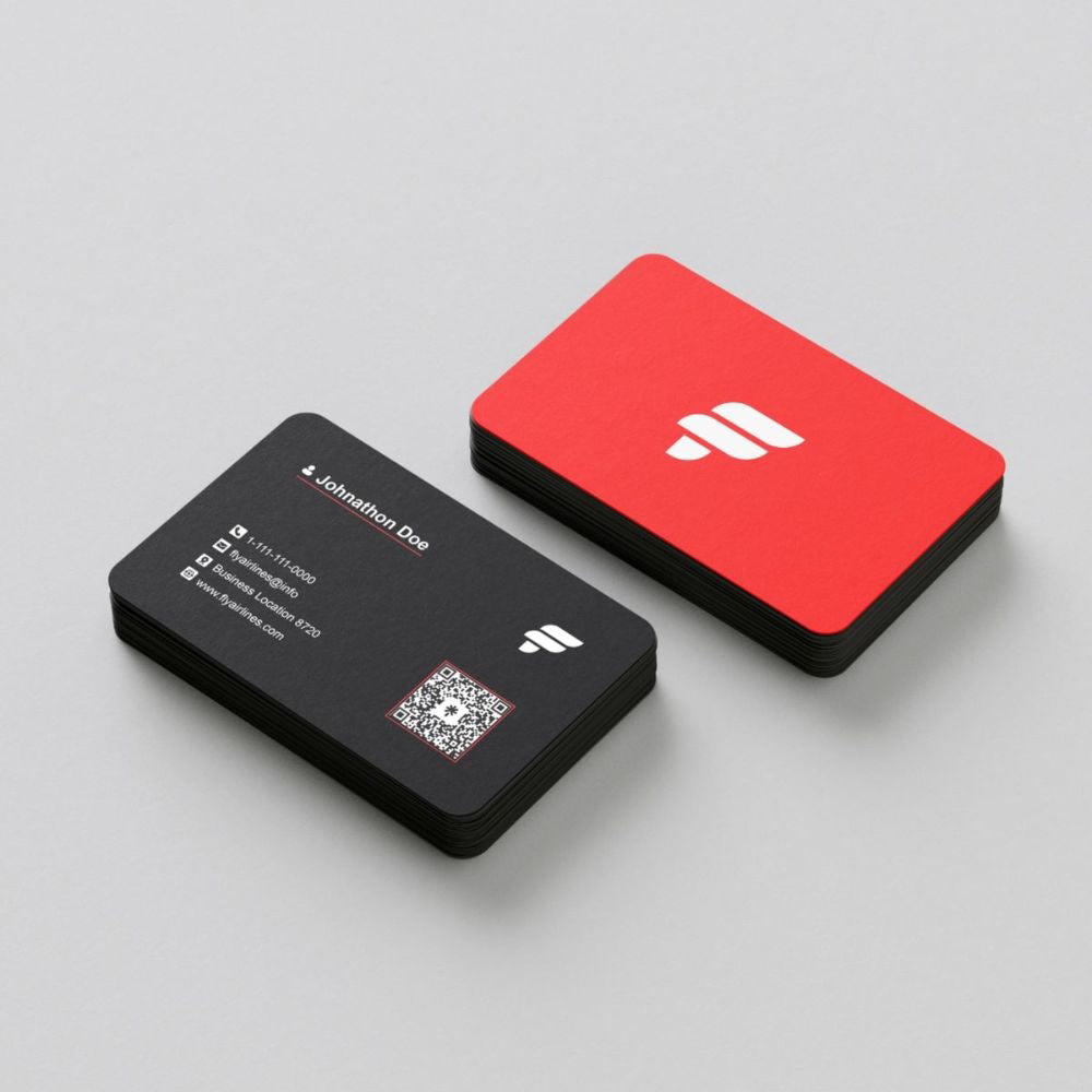 Two business cards, one black with text and a QR code, the other red with a logo, on a light gray background.