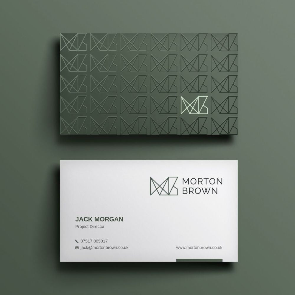 Two business cards with geometric design and branding on a green background