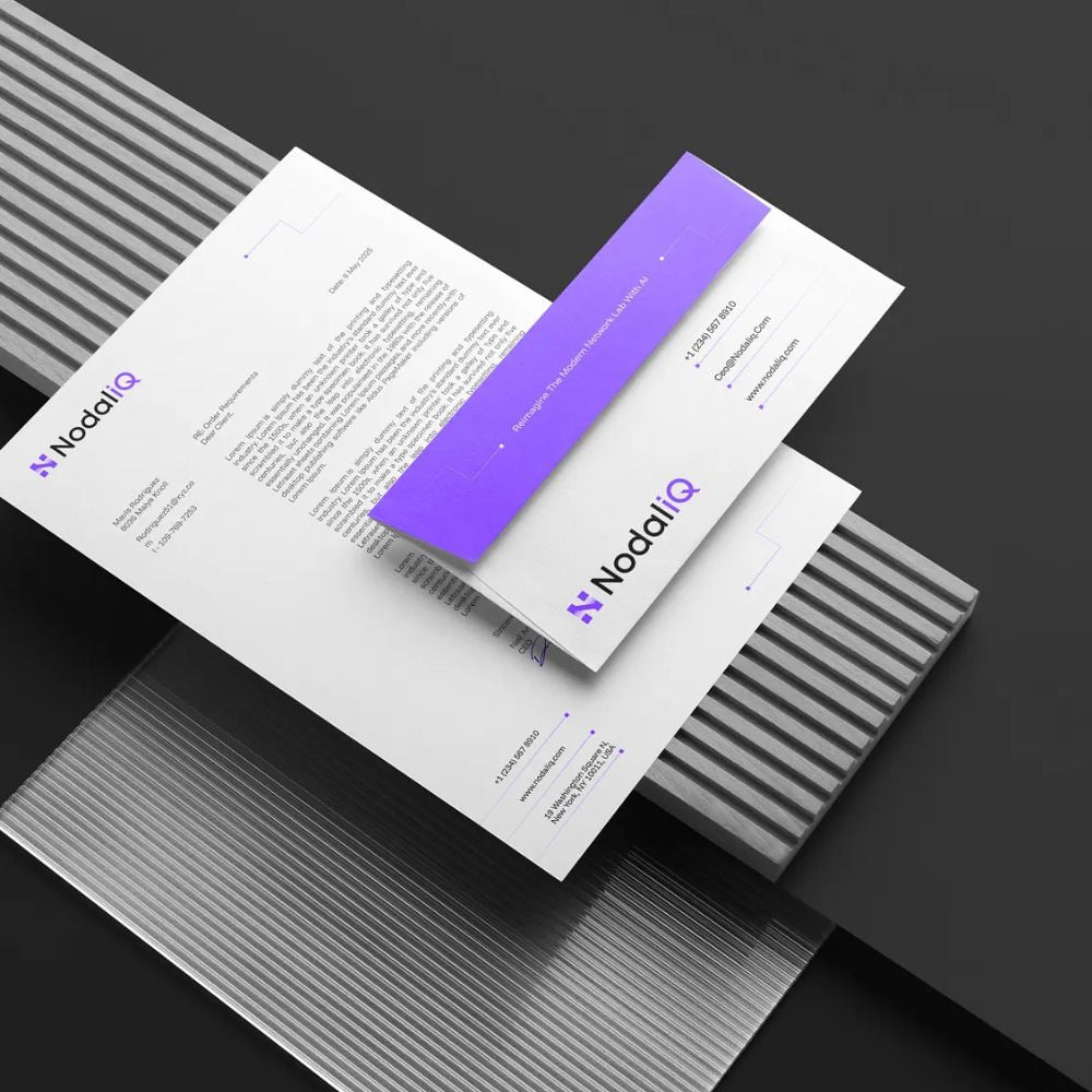 NodalIQ branded letterhead and business card on a dark background