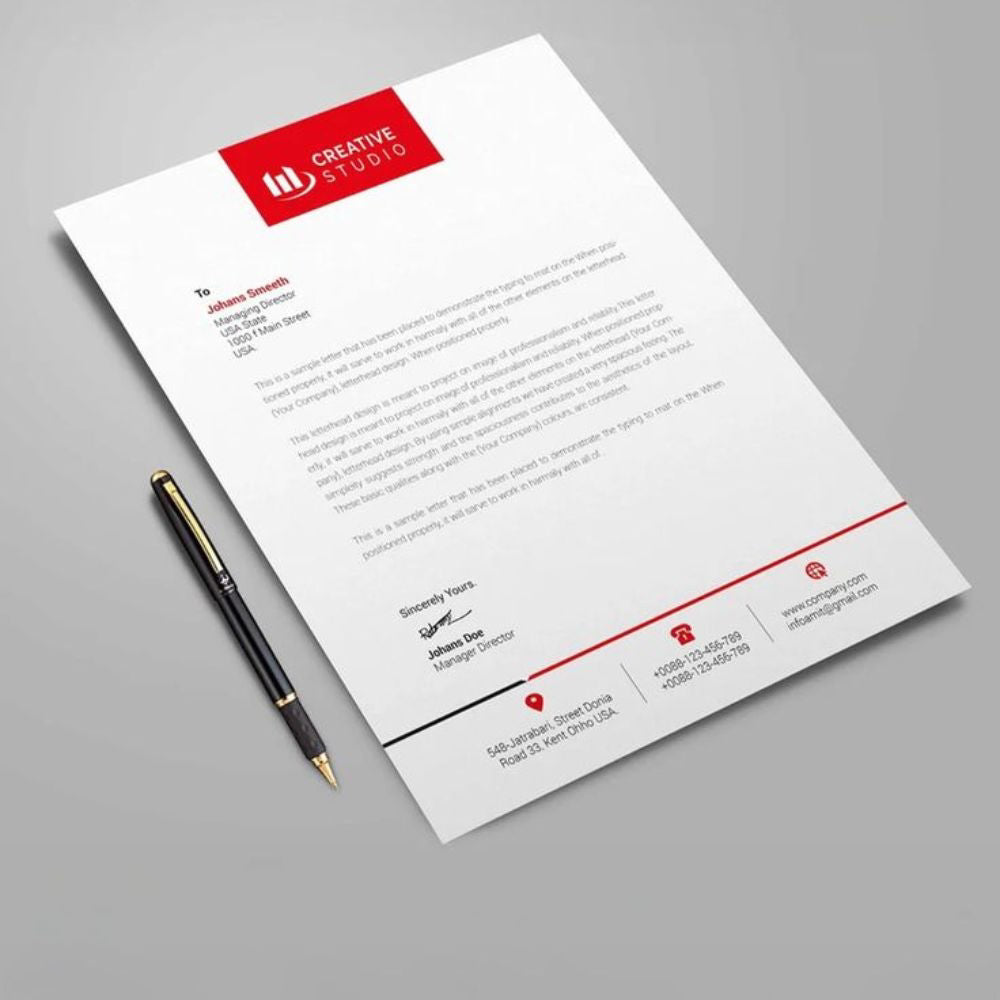 Letterhead with a pen on a gray background