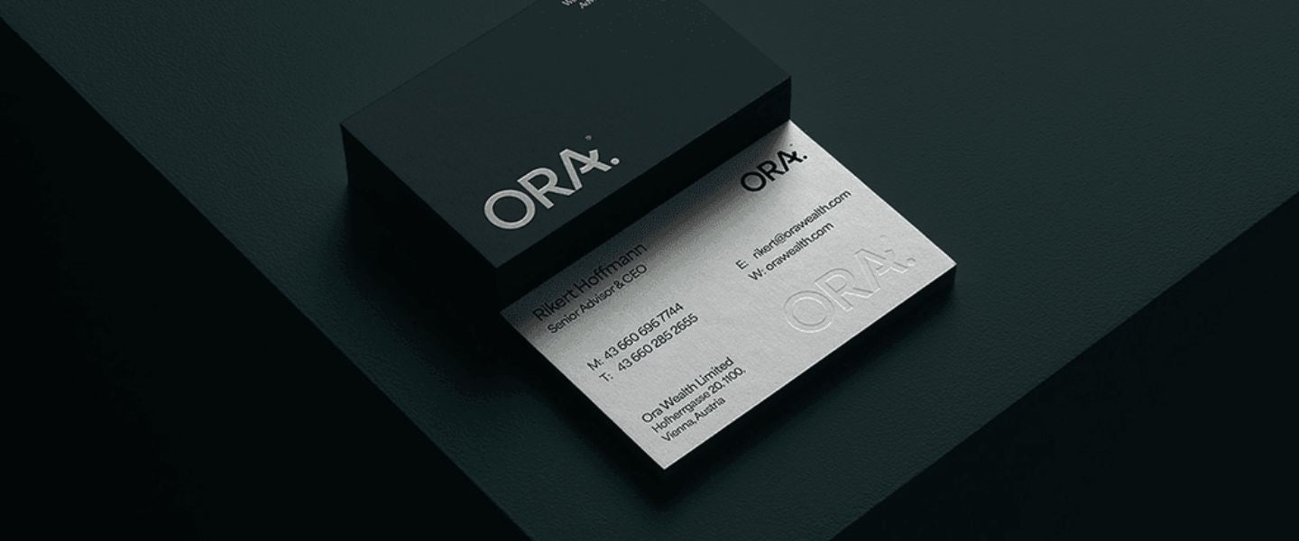 ORA business card on a dark surface